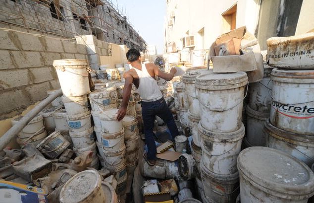 Old paints and waste materials, which were stored in workers' housing places in Qatar, October 2012 © Shaival Dalal
